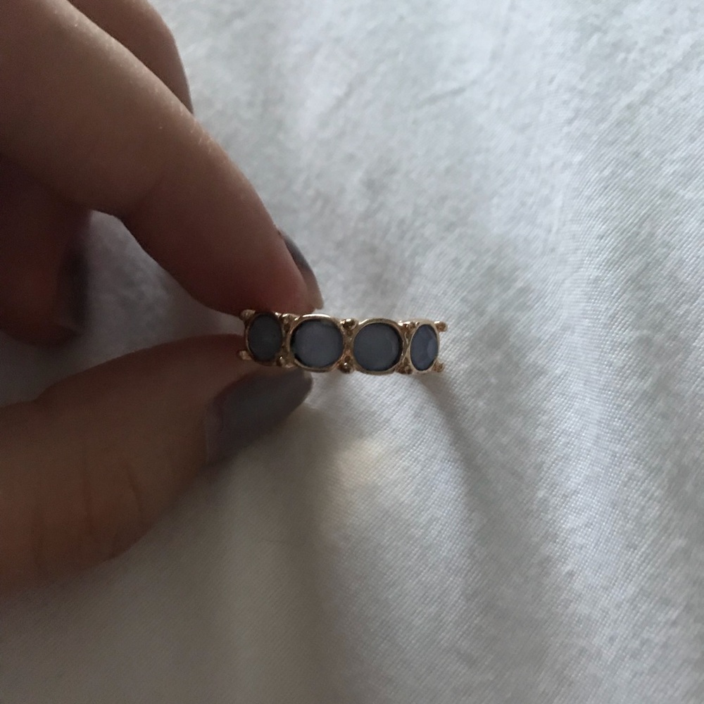 gold ring with blue jems